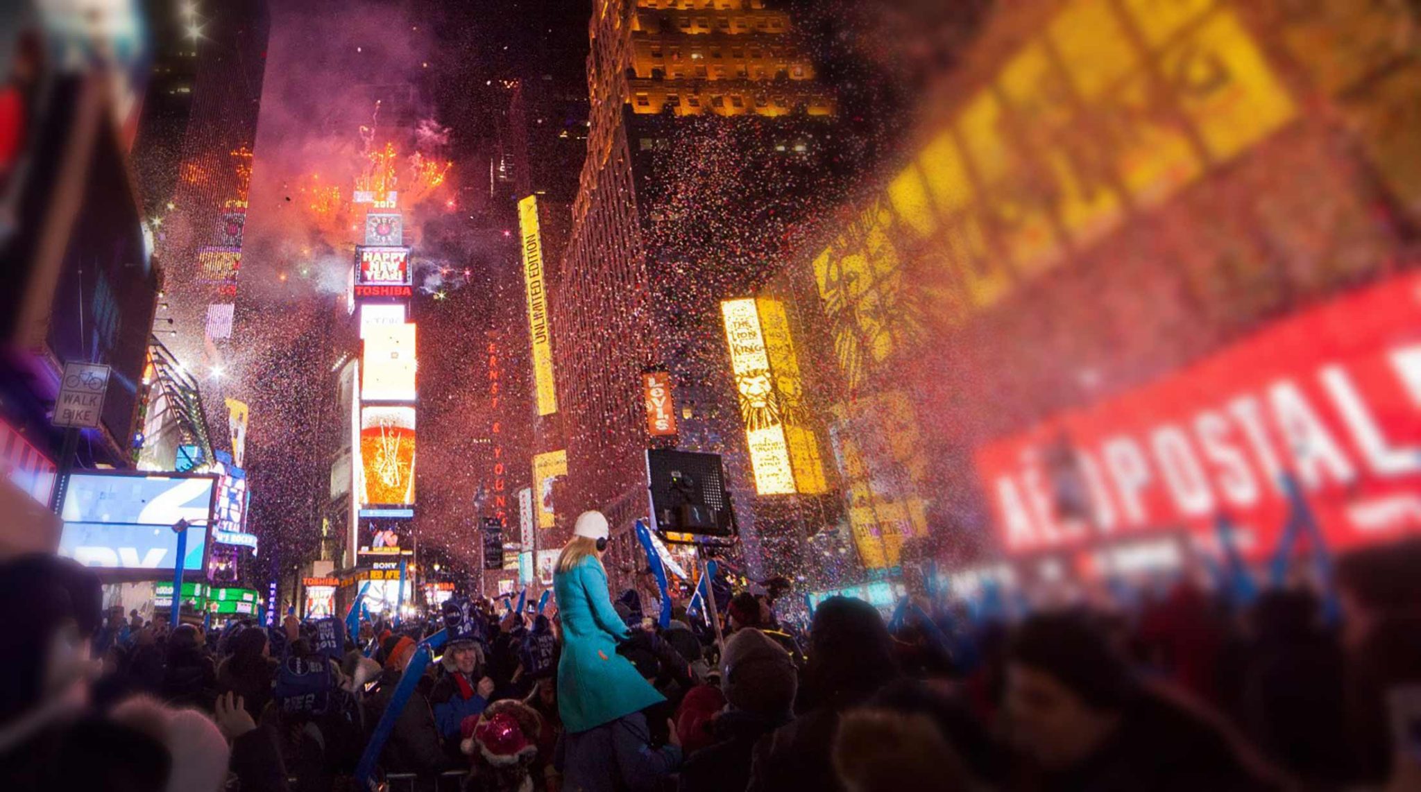 New Yorkers welcome the New Year in Time Square with fireworks, confetti, and a street party.